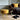 William & Irene Harris Tweed Mustard Footstool with Steel Hairpin Legs