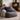 Grey bean bag chair with Harris Tweed Denim MacLeod cushion in front of a fireplace