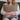 Woman holding a Harris Tweed Eriskay Bracken Herringbone cushion against a neutral background