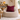 Beige bean bag chair with a Harris Tweed Claret red cushion in a cozy living room setting.