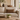 Beige sofa with a Harris Tweed Dunmore Houndstooth lumbar cushion in a living room setting with decorative items.