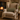 Beige armchair with a Harris Tweed Hazel Herringbone lumbar cushion in front of a fireplace