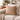 Harris Tweed Latte beige cushion on a light-colored sofa with a cozy living room setting.
