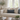 Beige sofa with a Harris Tweed Lomond Barleycorn lumbar cushion in a bright living room setting