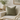 Harris Tweed Lovat Herringbone cushion on a beige sofa with a vase and books in the background