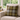 Harris Tweed MacLeod Tartan cushion on a beige sofa with a window and flowers in the background