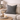 Harris Tweed Grey Marl cushion on a beige sofa with a candle and decorative items on a side table.