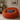 Orange bean bag chair with a Harris Tweed Mid Grey Marl lumbar cushion in a cozy room setting.
