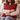 Woman holding a Harris Tweed Royal Stewart Tartan cushion