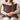 Woman holding a Harris Tweed Stornoway Tarton cushion on a couch