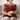 Woman holding a rHarris Tweed Winterberry Tartan cushion on a neutral background